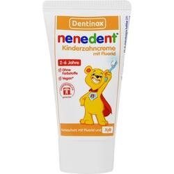Eine Kinderzahnpasta-Tube mit einem lächelnden Bären und einer roten Kappe.